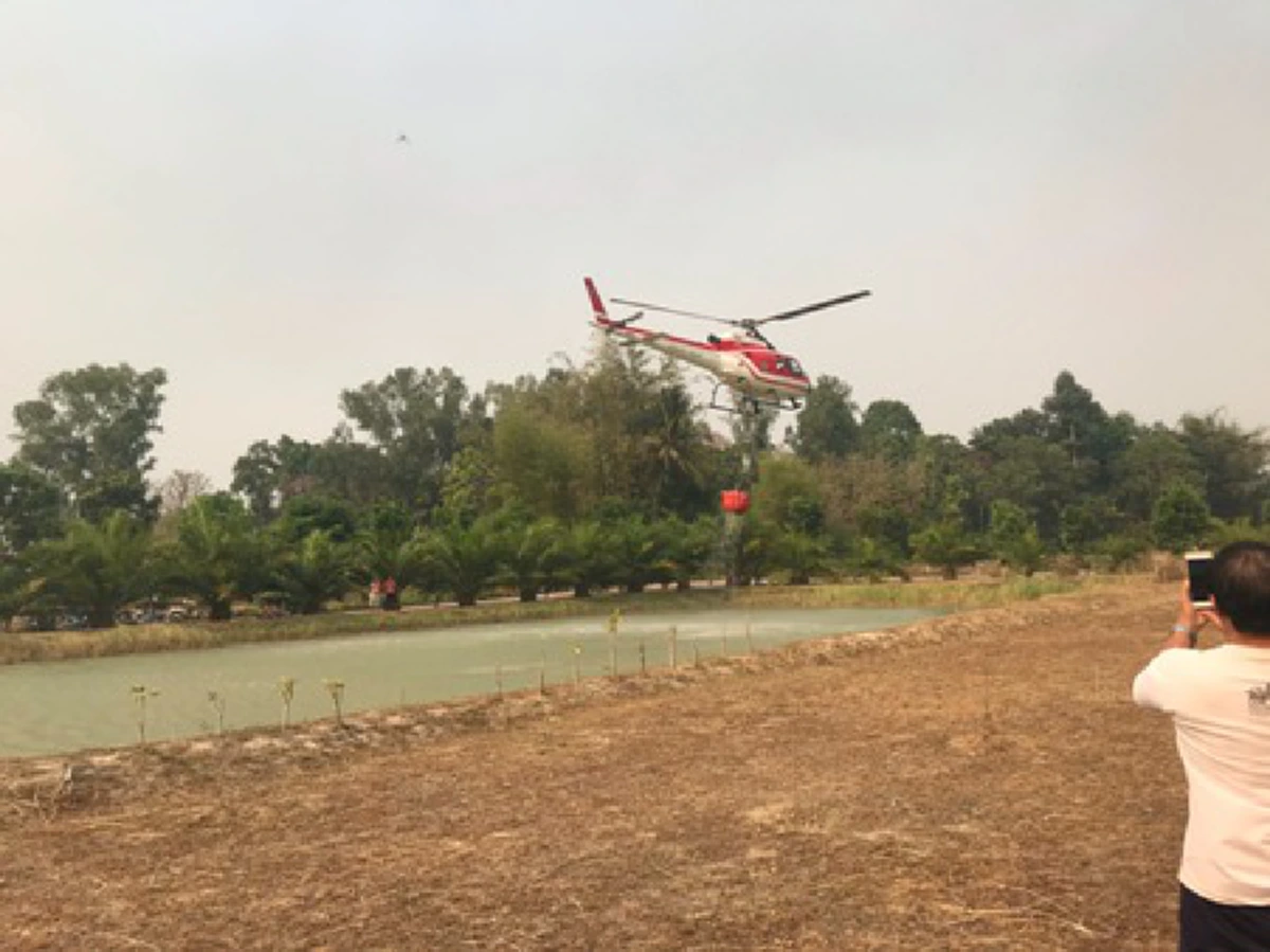 เฮลิคอปเตอร์โปรยน้ำ ดับไฟป่า แม่จัน